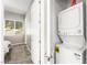 Convenient laundry closet with a stackable washer and dryer near the bedroom at 103 Reflection Cove Dr, Henderson, NV 89011