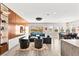 Spacious living room with open layout and seamless transition to dining area and backyard views at 103 Reflection Cove Dr, Henderson, NV 89011