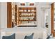Well-appointed bar area featuring custom cabinetry, ample storage, and a sleek countertop with barstool seating at 103 Reflection Cove Dr, Henderson, NV 89011