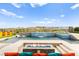 Resort-style pool area with waterfall feature and mountain views at 103 Reflection Cove Dr, Henderson, NV 89011