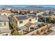Home with a tile roof and solar panels and covered patio in a well-designed neighborhood at 10611 Auburn Springs Ave, Las Vegas, NV 89166