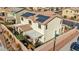 Home features solar panels, tile roof and backyard covered patio, all surrounded by a block wall at 10611 Auburn Springs Ave, Las Vegas, NV 89166