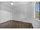 Bedroom with wood flooring, fan, and closet at 10611 Auburn Springs Ave, Las Vegas, NV 89166