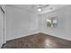 Bedroom with wood flooring, fan, and a window at 10611 Auburn Springs Ave, Las Vegas, NV 89166