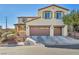 Charming two-story home featuring a terracotta-colored tile roof and a spacious two-car garage at 10611 Auburn Springs Ave, Las Vegas, NV 89166