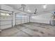 Spacious two-car garage with ample lighting, and a roll-up door at 10611 Auburn Springs Ave, Las Vegas, NV 89166