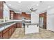 This kitchen features granite counters, stainless appliances, and an island with a breakfast bar at 10611 Auburn Springs Ave, Las Vegas, NV 89166