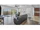 Bright living room features modern ceiling fan, recessed lighting, and sliding door access to the outdoor patio at 10611 Auburn Springs Ave, Las Vegas, NV 89166