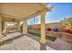 Covered patio with brick pavers, ceiling fan and exterior pillars at 10611 Auburn Springs Ave, Las Vegas, NV 89166