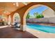 Inviting backyard pool and covered patio area perfect for outdoor entertaining and relaxation at 11117 Romola St, Las Vegas, NV 89141
