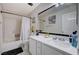 This bathroom features a shower-tub combo and a large mirror at 11117 Romola St, Las Vegas, NV 89141