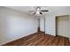 This bedroom has wood flooring, white walls, and a closet at 11117 Romola St, Las Vegas, NV 89141