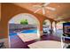 Charming covered patio overlooking the backyard pool, great for entertaining and relaxation at 11117 Romola St, Las Vegas, NV 89141