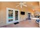 Spacious covered patio with ceiling fans, outdoor lighting, and access to the backyard pool at 11117 Romola St, Las Vegas, NV 89141