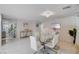 Elegant dining area with a glass table and white chairs, showcasing an open layout at 11117 Romola St, Las Vegas, NV 89141
