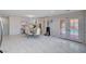 Open-concept living area with a dining set and access to outdoor pool via french doors at 11117 Romola St, Las Vegas, NV 89141