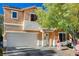 Charming two-story home featuring a two-car garage and a welcoming entrance; holiday decor on display at 11117 Romola St, Las Vegas, NV 89141