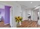 Hallway featuring hardwood floors with access to a bedroom painted purple and other rooms at 11117 Romola St, Las Vegas, NV 89141