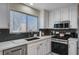 Modern kitchen featuring stainless steel appliances, white countertops, and ample natural light at 11117 Romola St, Las Vegas, NV 89141