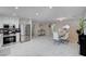 Spacious living area with dining set and adjacent kitchen showcasing a modern design at 11117 Romola St, Las Vegas, NV 89141