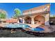A private pool and spa offer a luxurious outdoor retreat with a covered patio and manicured landscaping at 11117 Romola St, Las Vegas, NV 89141