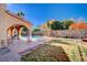 Refreshing pool with covered patio and seating area in a private backyard oasis at 11117 Romola St, Las Vegas, NV 89141