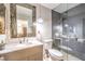 Modern bathroom with a glass shower, mosaic mirror, and vanity at 1112 Caraway Ln, Las Vegas, NV 89144