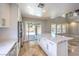Open concept kitchen with an island, stainless steel appliances, and backyard access at 1112 Caraway Ln, Las Vegas, NV 89144
