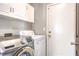 Practical laundry area with appliances and storage space at 1112 Caraway Ln, Las Vegas, NV 89144