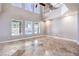 Bright living room with travertine flooring, high ceilings, and views of the backyard pool at 1112 Caraway Ln, Las Vegas, NV 89144