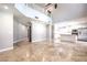 Spacious living room featuring tall ceilings, tile floors, neutral walls, and an open floor plan, ideal for entertaining guests at 1112 Caraway Ln, Las Vegas, NV 89144