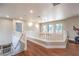 Upstairs loft featuring hardwood floors and ample sunlight from the many windows at 1112 Caraway Ln, Las Vegas, NV 89144