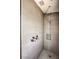 Elegant tiled shower with rainfall shower head and updated fixtures in the spacious bathroom at 1112 Caraway Ln, Las Vegas, NV 89144