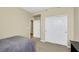 Bedroom with double closets, neutral walls and carpet, and an open doorway at 1265 Inward Hill St, Henderson, NV 89002
