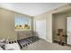Bedroom with a pair of pet kennels, window and interior closet and a small pet tree at 1265 Inward Hill St, Henderson, NV 89002
