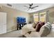 Comfortable bedroom featuring a ceiling fan, neutral tones, and large windows for ample natural light at 1265 Inward Hill St, Henderson, NV 89002