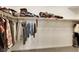 Large walk-in closet with ample storage space on multiple shelves and hanging rods at 1265 Inward Hill St, Henderson, NV 89002