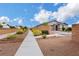Street view of a single-story home featuring desert landscaping and a sidewalk at 1265 Inward Hill St, Henderson, NV 89002