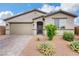 Charming single-story home with a well-maintained front yard and a two-car garage at 1265 Inward Hill St, Henderson, NV 89002