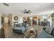 Open-concept living room with hardwood floors and seamless flow to the kitchen and dining areas at 1265 Inward Hill St, Henderson, NV 89002