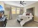 Cozy main bedroom with plush carpet, decorative headboard, and ample natural light at 1265 Inward Hill St, Henderson, NV 89002