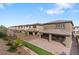 Expansive backyard with covered patio, pavers, and artificial turf at 127 Medianoche St, Las Vegas, NV 89138