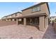 Backyard patio area featuring brick pavers and view of neighborhood at 127 Medianoche St, Las Vegas, NV 89138
