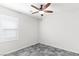 Bedroom featuring a ceiling fan and a window with plantation shutters at 127 Medianoche St, Las Vegas, NV 89138