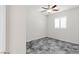 Bedroom featuring a ceiling fan and a window with plantation shutters at 127 Medianoche St, Las Vegas, NV 89138