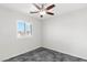 Bedroom featuring a ceiling fan and a window with plantation shutters at 127 Medianoche St, Las Vegas, NV 89138