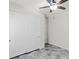 Bedroom featuring sliding door closet, ceiling fan, and gray wood-look flooring at 127 Medianoche St, Las Vegas, NV 89138