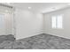 Bedroom with shuttered window, grey floors, and white trim at 127 Medianoche St, Las Vegas, NV 89138