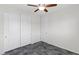 Bedroom featuring a ceiling fan and closet with sliding doors at 127 Medianoche St, Las Vegas, NV 89138