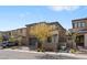 Attractive two-story home showcasing a gray exterior, two-car garage, and manicured landscaping at 127 Medianoche St, Las Vegas, NV 89138